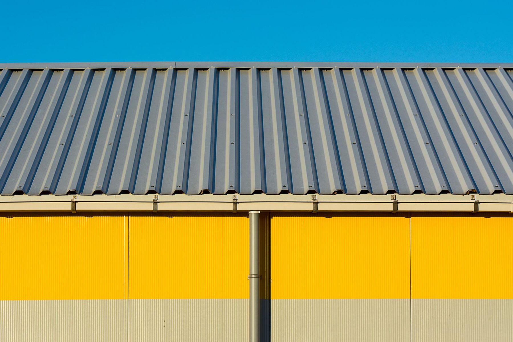 Metal building exterior with a corrugated roof